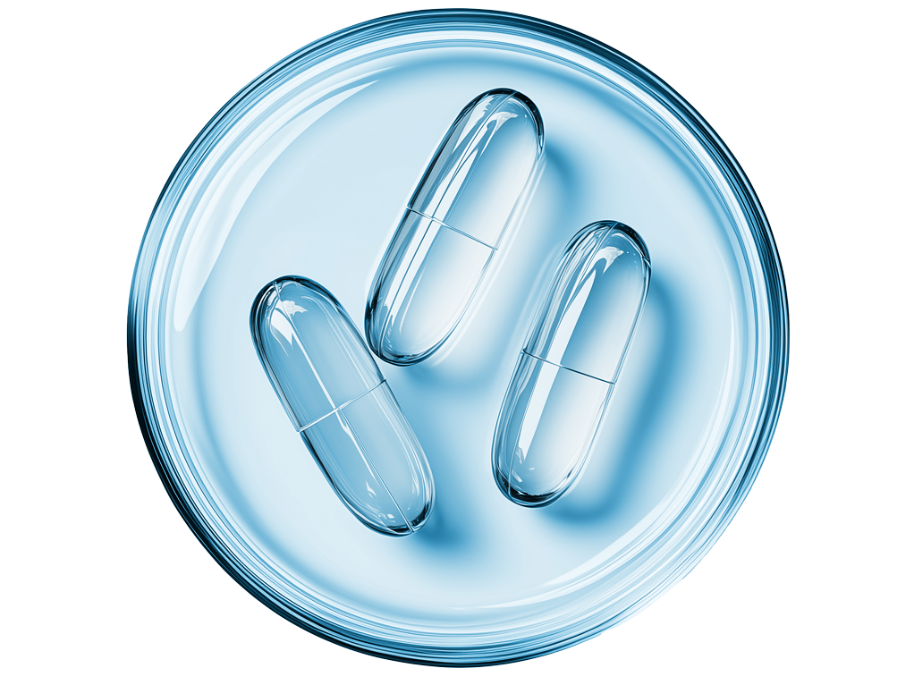 Foto Draufsicht Petrischale mit drei Kapseln, blau-transparent eingefärbt